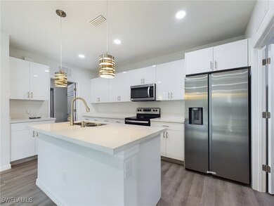 Kitchen featuring sink, hanging light fixtures, li