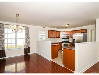 Kitchen appliances include a Whirlpool stainless s