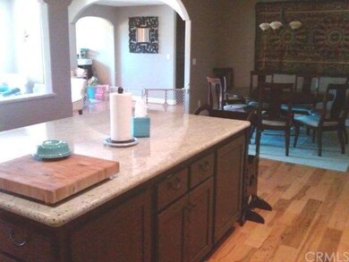 Kitchen has large granite island with plenty of st