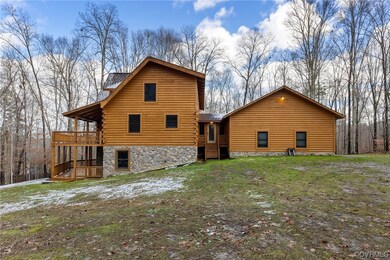 Back of house featuring a wooden deck