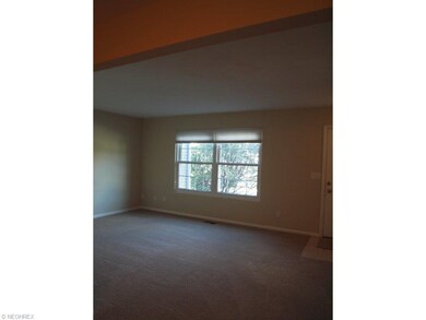 Spacious living room with two large windows