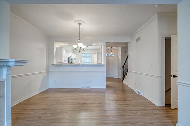 The dining room is open to the kitchen and living