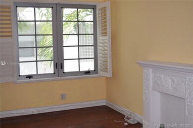 High impact windows with wood plantation shutters.