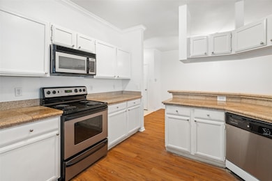 Kitchen featuring appliances with stainless steel