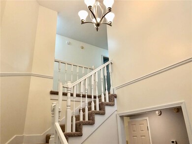 Freshly painted entryway, bannister and railings. 