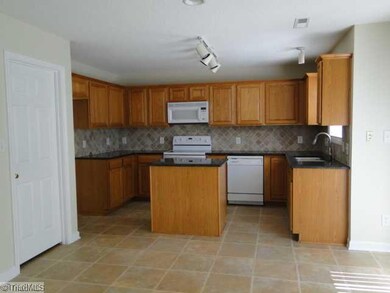 Kitchen. Large kitchen with new granite counter top and ceramic back splash