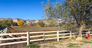 View of mountain backdrop with rural landscape