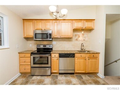 Remodeled kitchen with granite counter tops.