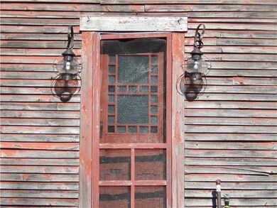 Exterior Front. Onion globe lamps.