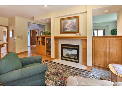 The cozy hearth area with 2 sided fireplace is nes