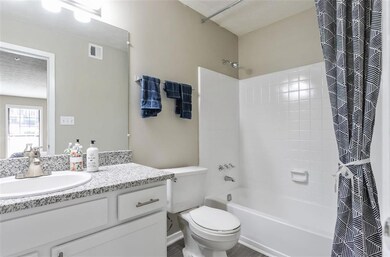 Full bathroom with vanity, shower / tub combo, and