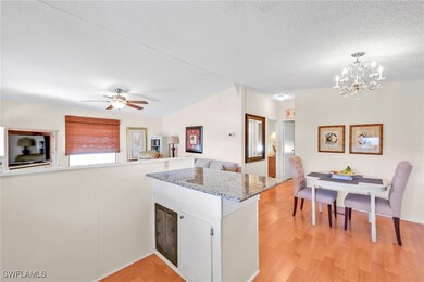 Kitchen with light wood finished floors, visible v