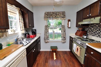 The kitchen comes equipped with an electric range/