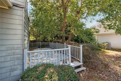 Fenced backyard with a deck