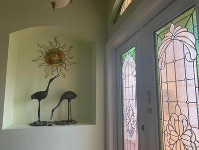 ENTER INTO THE FOYER HIGH CEILINGS