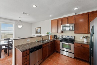 Stay connected while cooking—this open kitchen design keeps the chef in the heart of the action with views into the dining and living areas.