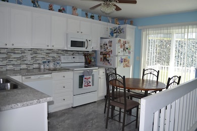 Kitchen with sliding glass door to back