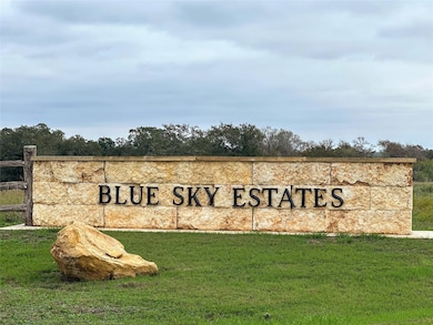 Community sign with a lawn