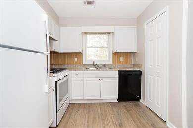 Kitchen featuring light countertops, visible vents