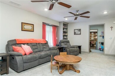 LIVING ROOM LOOKING AT BUILT IN BOOKCASE AND TOWAR