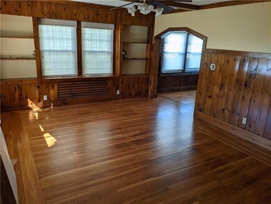 Formal living room, built-ins, hardwood floors