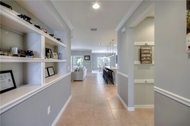 Entrance hallway showing built in shelves on the l