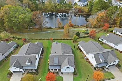 Aerial view of residential area featuring a large body of water