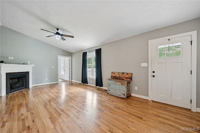 Unfurnished living room featuring light wood-style
