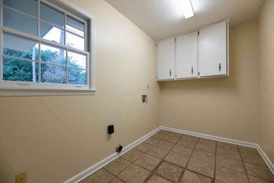 Large Laundry Room with Cabinets