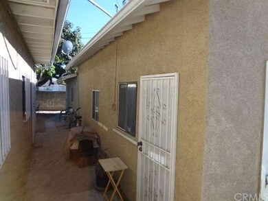Side of garage and Guest House to rear.