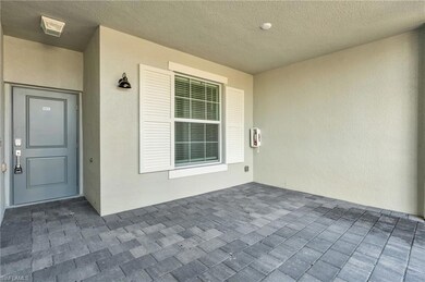 Property entrance featuring stucco siding
