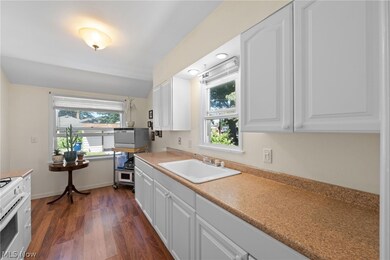 Kitchen  dark wood-type flooring, and a wealth of natural light