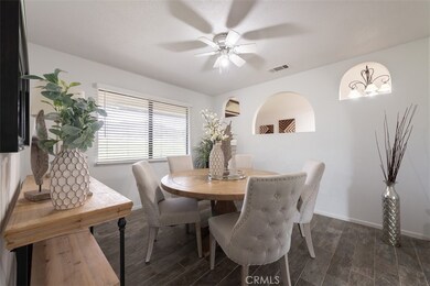 Dining space with Spanish style arches open to the entryway