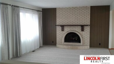 There is new carpet throughout the home. Fireplace has electric insert in it.