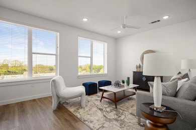 Living area featuring wood finished floors, ceili