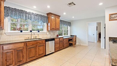 Plenty of cabinets with built in desk and pantry