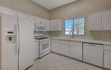 Light and Bright white kitchen cabinets with gold