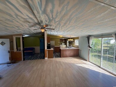 Unfurnished living room with wood finished floors,
