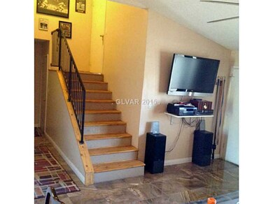 Property Photo. Knotty pine wood stairs to master