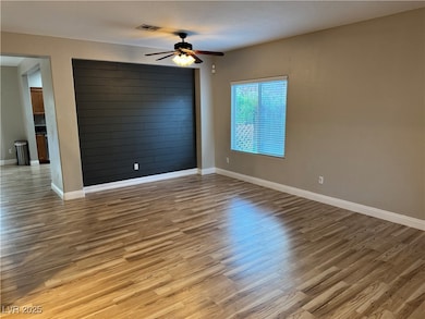 Empty room with light wood finished floors and a ceiling​​‌​​​​‌​​‌‌​​​‌​‌​​​‌‌​​​‌‌​​​​​​‌‌​‌‌‌ fan