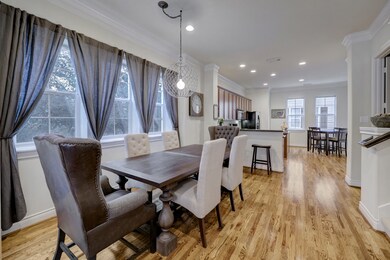 Living room flows into the dining room. Contempora