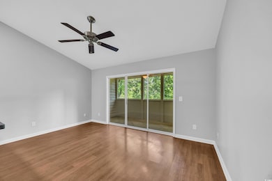 Unfurnished room featuring baseboards, wood finish