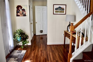Foyer with dark hardwood flooring