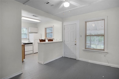 Foyer entrance featuring dark wood-style flooring,