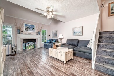 Vaulted living room w/ fireplace