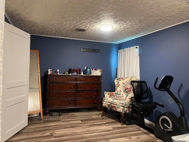 Large primary bedroom allows you to have extra dressing space, have a makeup vanity, or just a space to sit and watch tv.