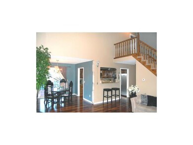 The living room is open to the casual dining room.