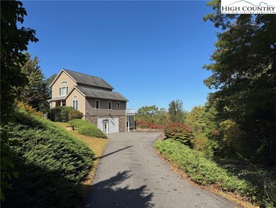 Large paved parking area and a walk into finished basement.