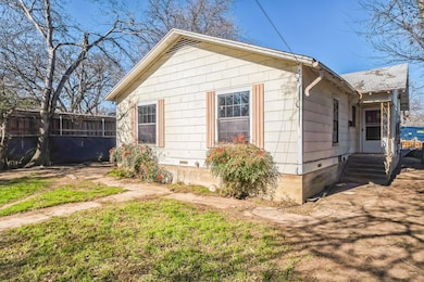 View of side of home with a yard