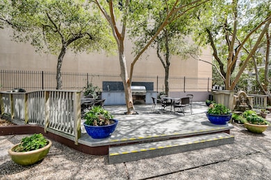 Outdoor kitchen/bbq area with tables and chairs